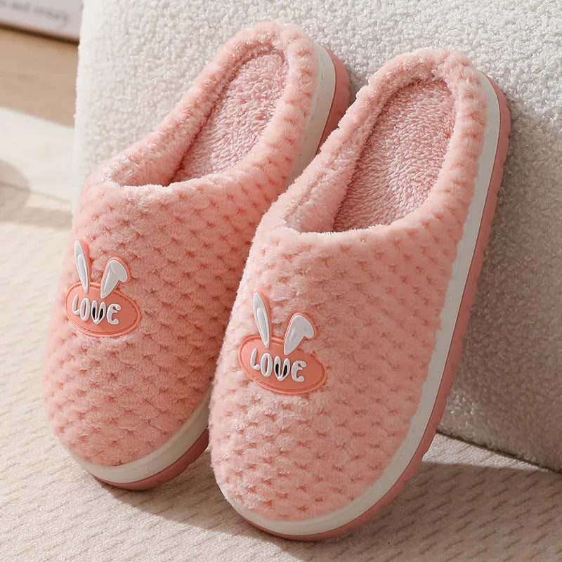 Women's rabbit plaid design artificial fur house slippers with thick rubber soles in apricot colour.