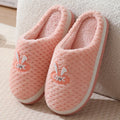 Women's rabbit plaid design artificial fur house slippers with thick rubber soles in apricot colour.