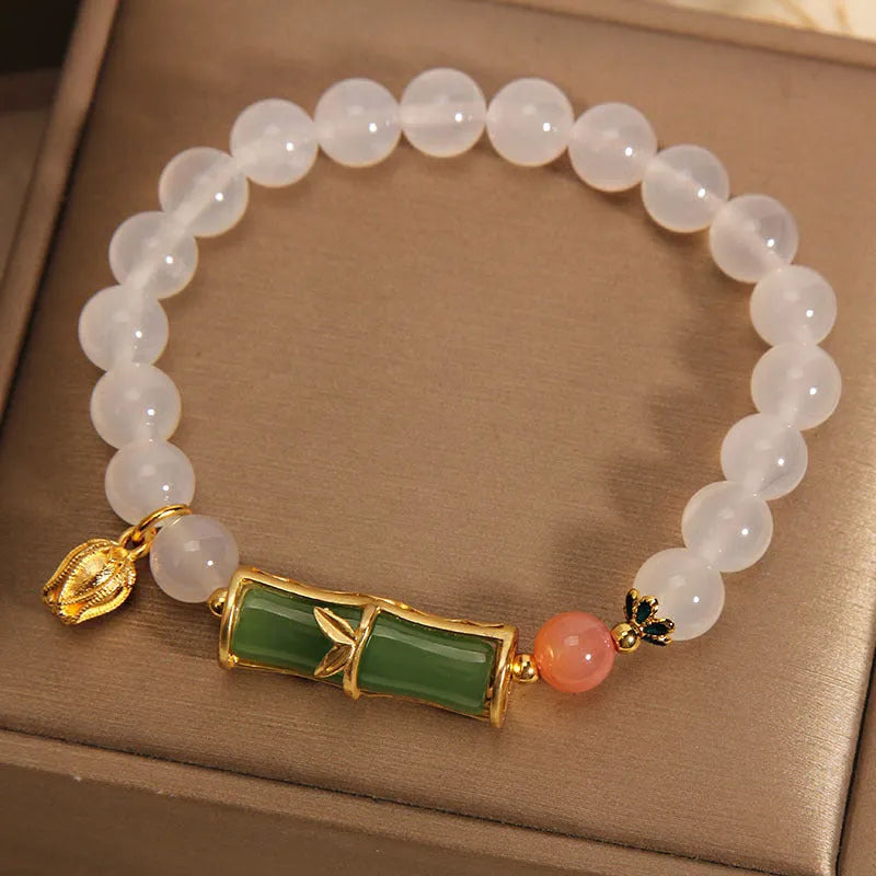 Women's Chinese style bamboo beaded bracelet with white agate jasper charm and natural jade materials