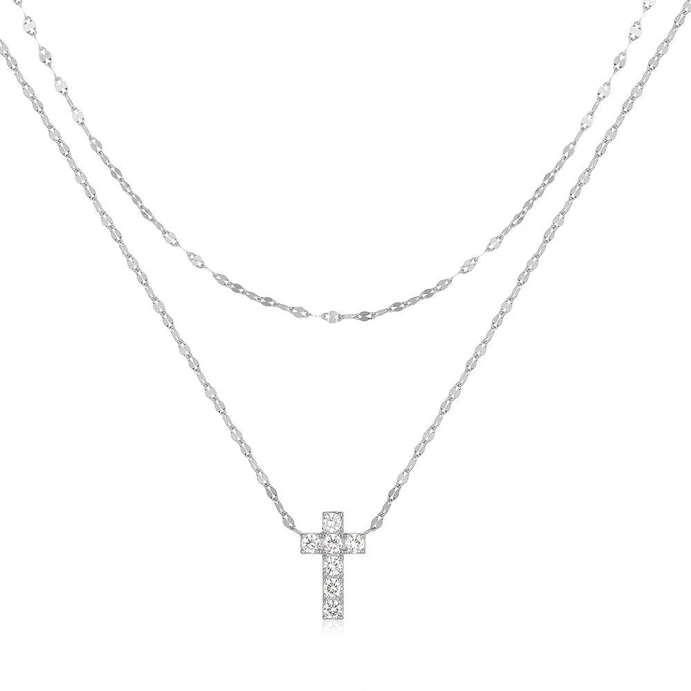Sterling silver double layer twin diamond cross necklace on a clavicle chain, shown in gold tone.