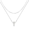 Sterling silver double layer twin diamond cross necklace on a clavicle chain, shown in gold tone.