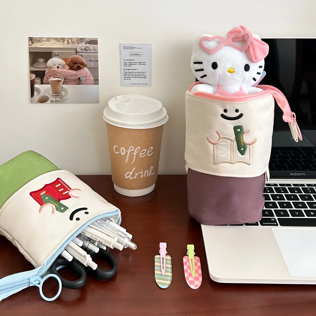 Brown collapsible Korean style cartoon print pencil case made from Oxford fabric.