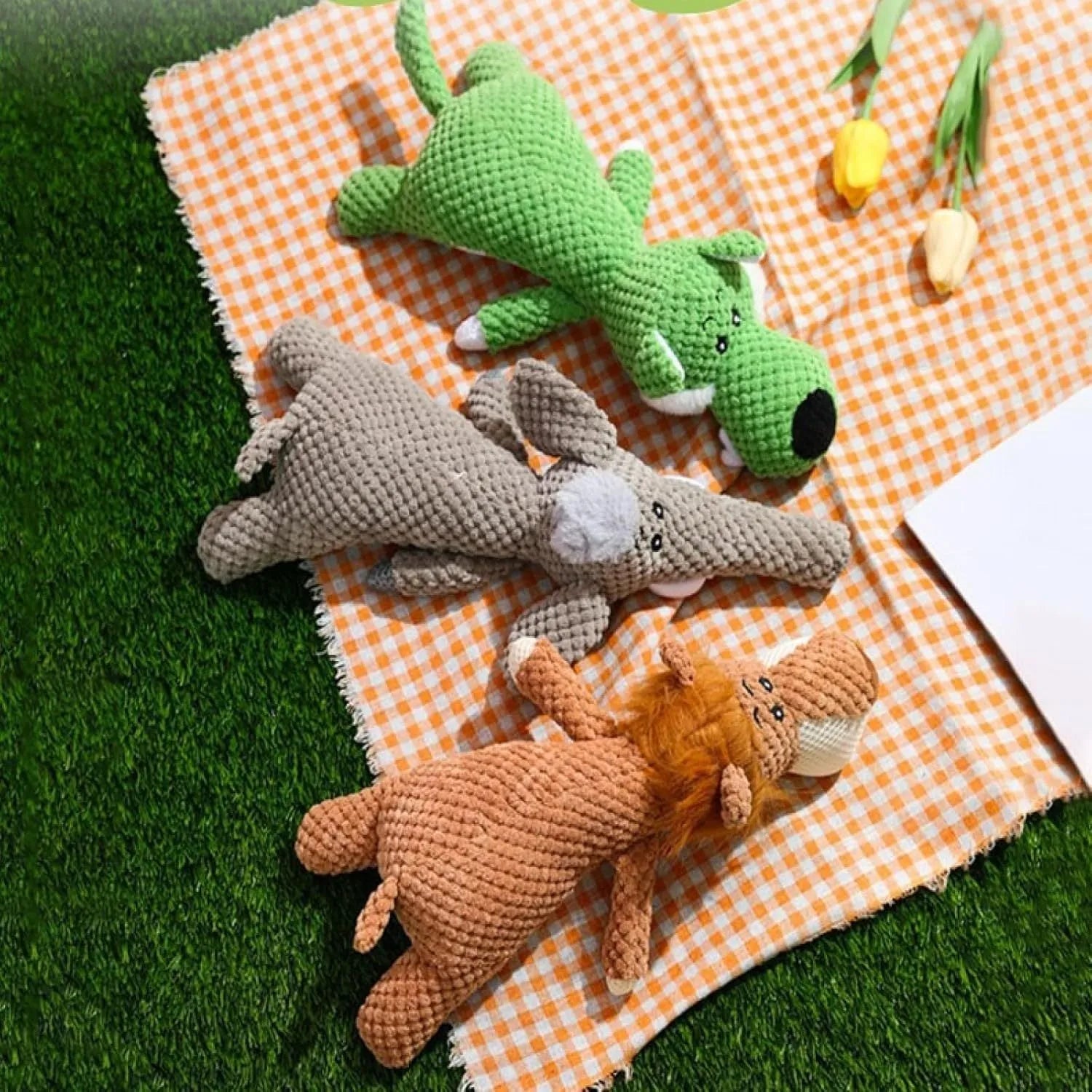 Plush dog dental toy with corn kernel texture and animal shape in green colour