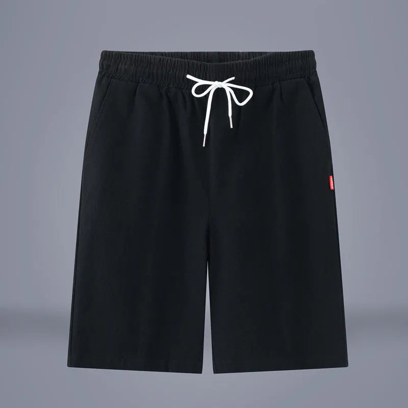 Solid colour cotton linen cropped summer pants on a hanger, showing mid-waist and drawstring detail.