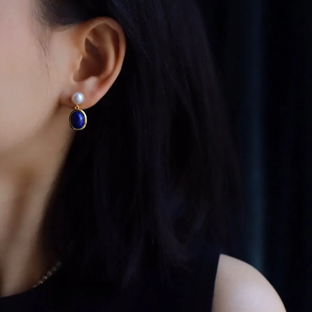 A pair of simple lapis lazuli pearl dangle earrings in 925 sterling silver with auspicious patterns.