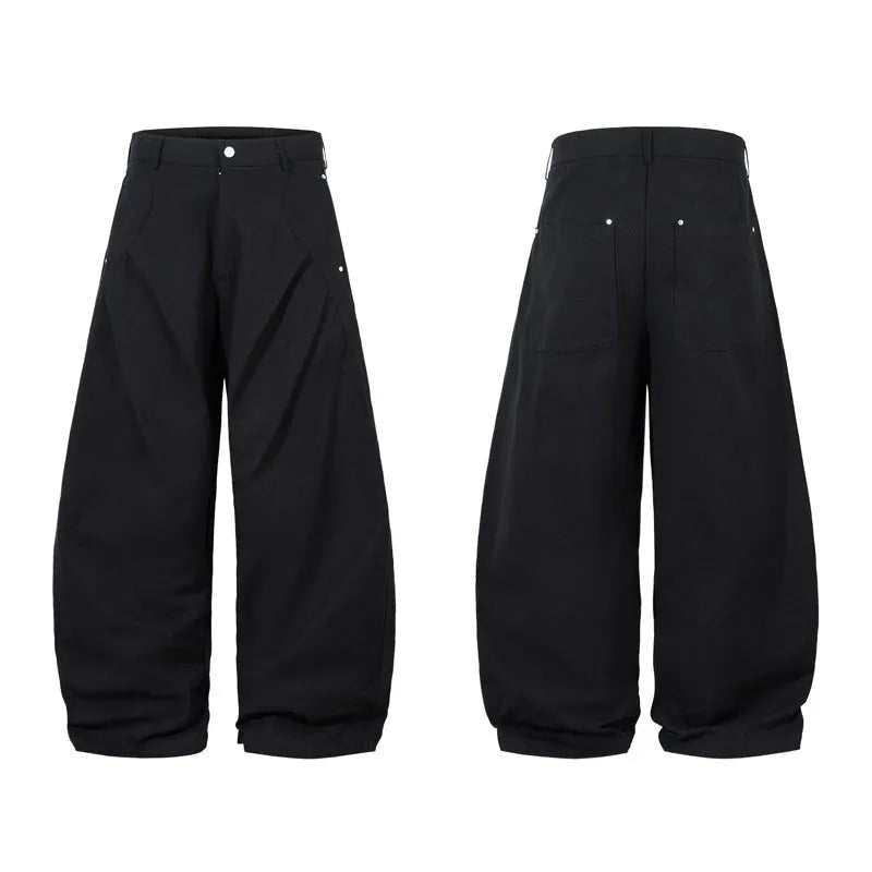 Men's black pleated machete casual pants with loose-fitting wide-leg styling in cotton fabric