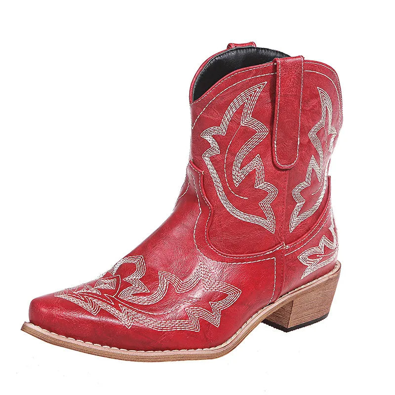 Blue women's cowboy boots with embroidery, a low wedge heel, and a pointed toe.