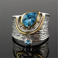 Women's blue zircon ring with Chinese style design and drop shape, shown in alloy.