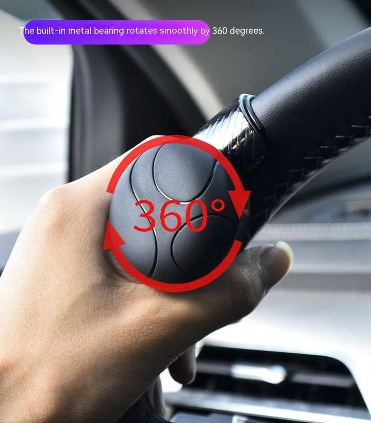 Black and blue silicone steering wheel assist ball showing 9cm by 6cm dimensions