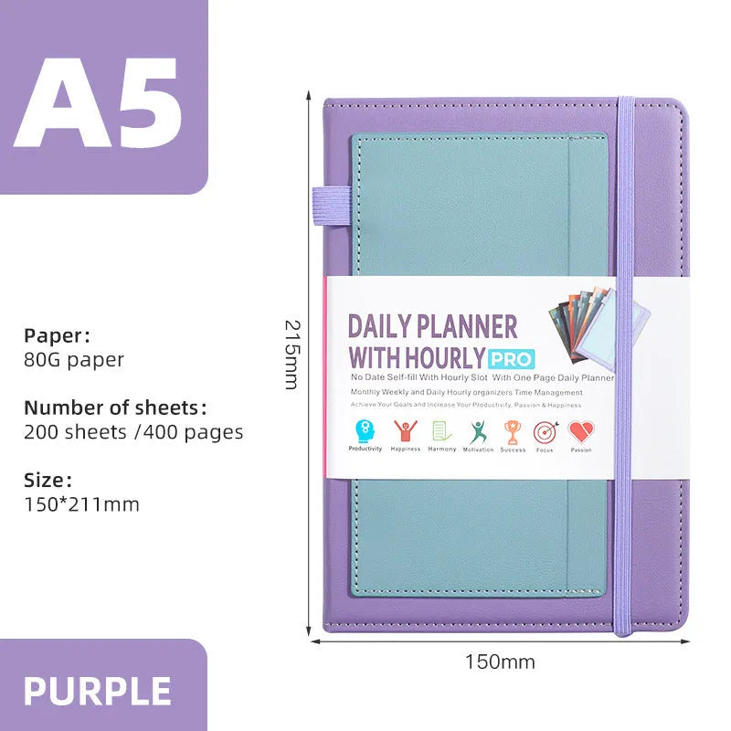A6 self-filled notebook with PU cover in various colours, shown open on wooden table.