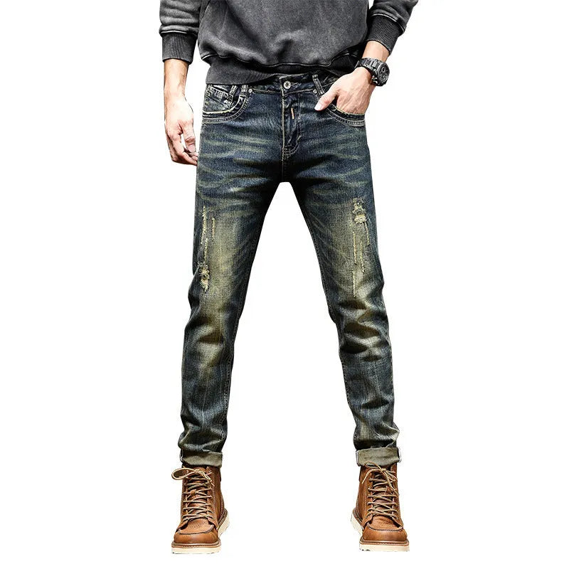 Men's skinny fit jeans in a retro colour with a zip fly, shown laid flat.