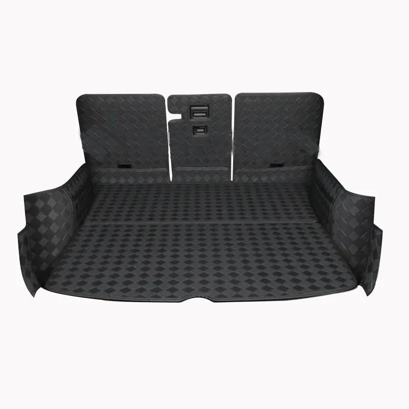 Black leather boot liner mat fitted in the luggage compartment of a Tesla Model Y