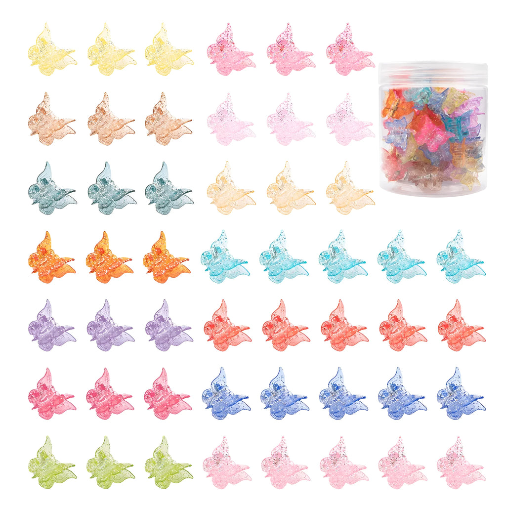 Assortment of glittery mini butterfly-shaped hair claw clips in multiple colours on a white background.