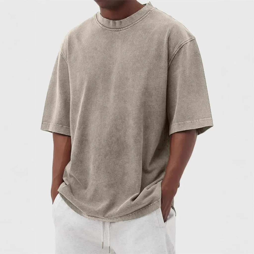 Men's loose fit distressed pullover T-shirt in solid colour options including blue, black, and army green