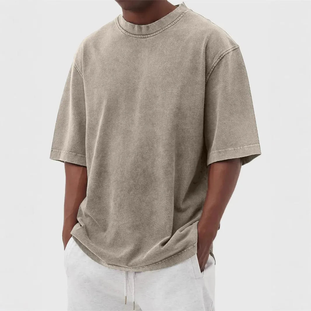 Men's loose fit distressed pullover T-shirt in solid colour options including blue, black, and army green