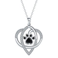 Copper necklace with dog paw and cat footprint pendant on a cross chain.
