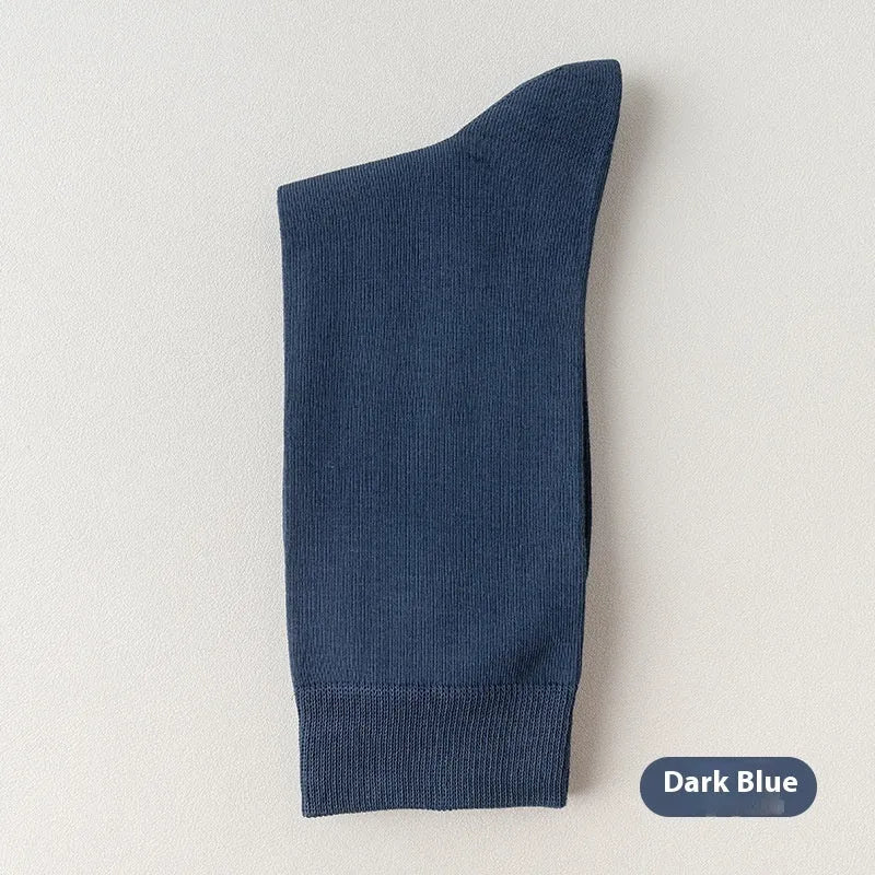A pair of men's solid colour mid-calf socks made from combed cotton for business wear.
