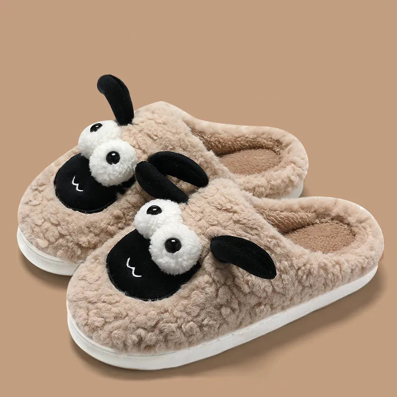 Brown, grey, and white suede slip-on slippers with a PVC sole on a plain background.