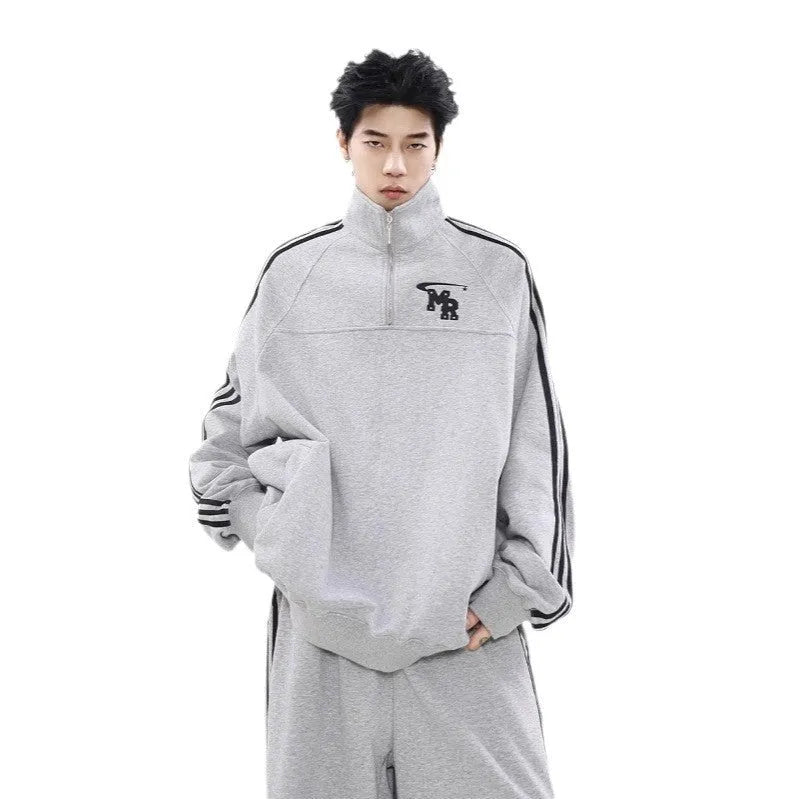 Black long sleeve sports hoodie with stand collar showing Hong Kong style details