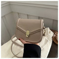 Soft PU leather messenger bag with clamshell opening shown in horizontal square shape on a shoulder strap.