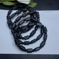 Natural black tourmaline rough stone bracelet with unpolished beads on wrist