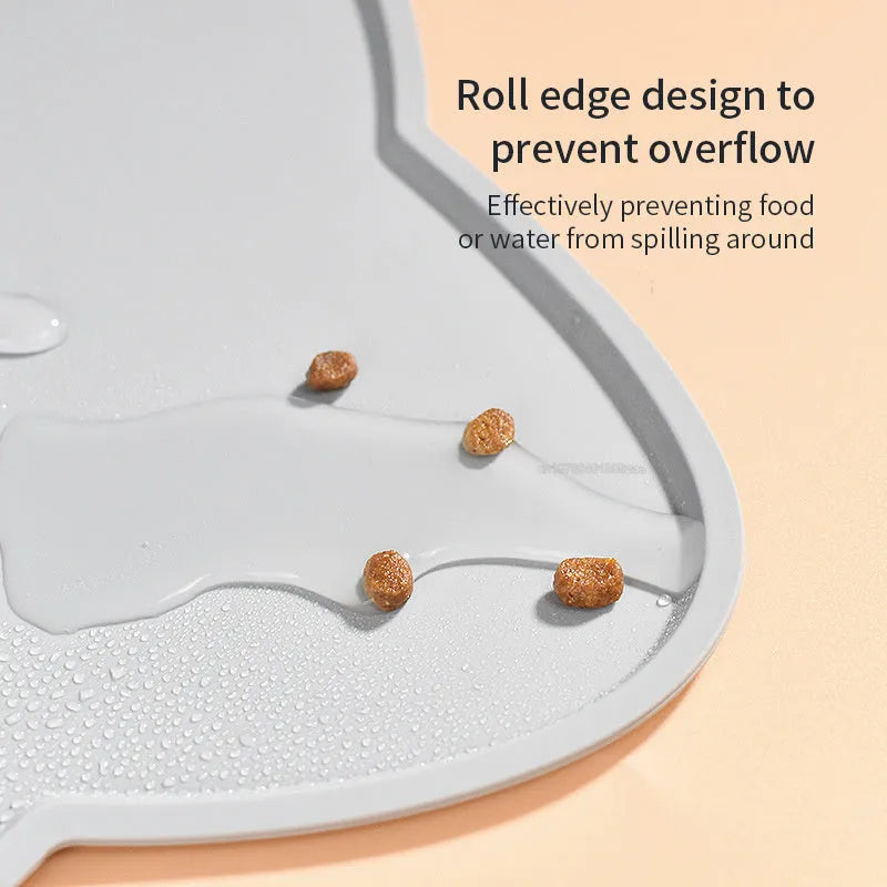Silicone waterproof pet feeding mat with cat head design measuring 44x24cm in solid colours
