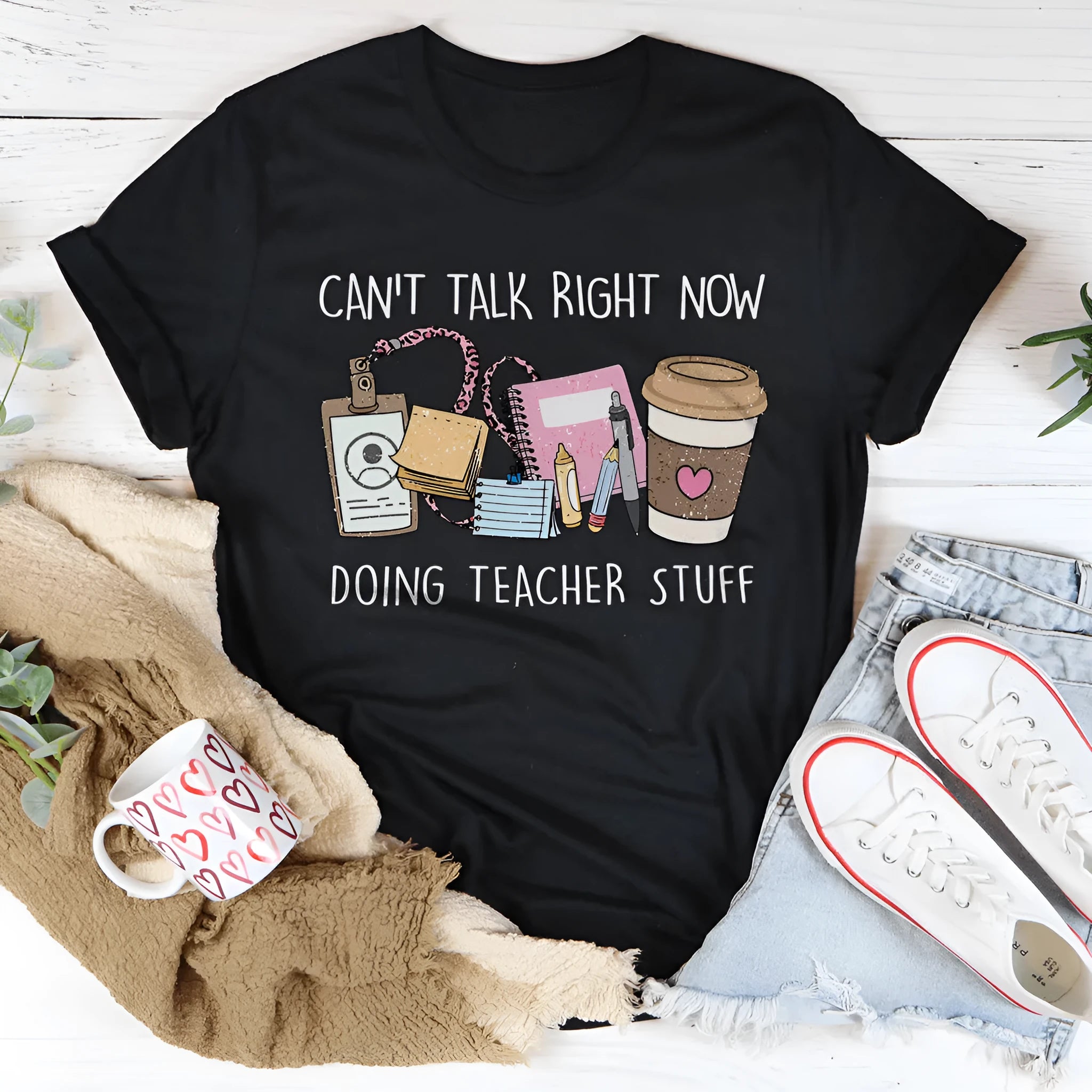 Black straight-fit cotton T-shirt with short sleeves and a round neck.