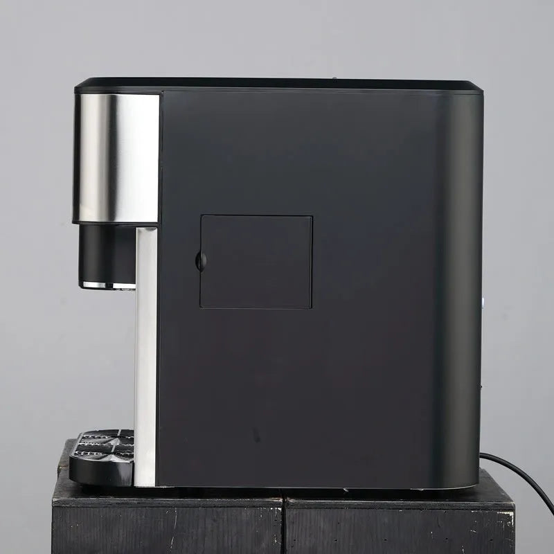 Black desktop ice maker with stainless steel components showing ice production, crushing, and water dispensing functions