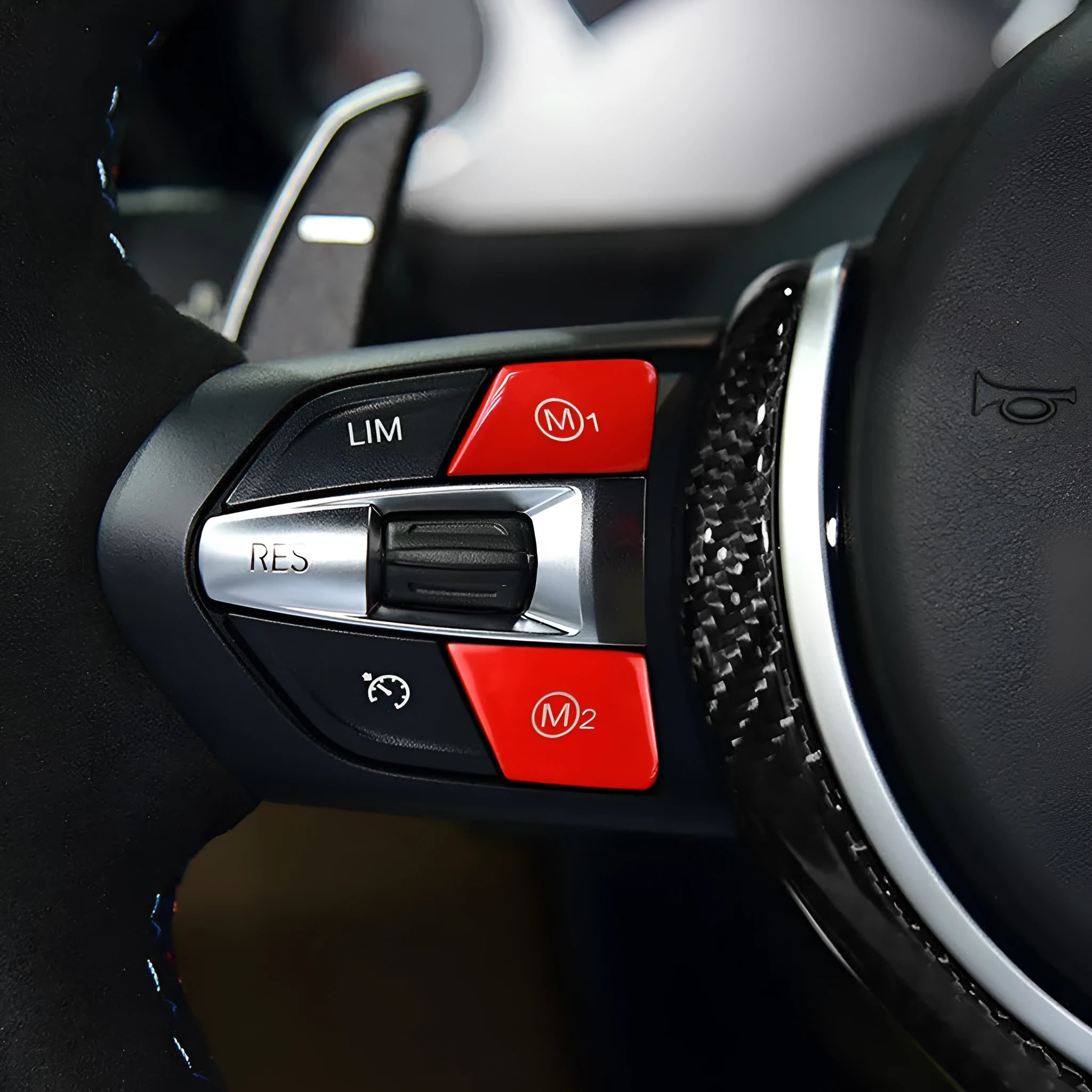 Pair of red and blue BMW steering wheel M1 M2 mode button accessories made from ABS plastic.