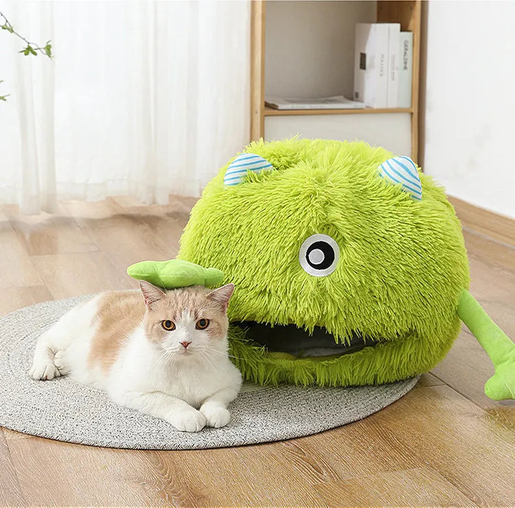 A round fluffy pet bed for cats and small dogs on a wooden floor.
