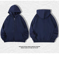 A plus size man wearing a heavy grey zip-up hooded cardigan sweater with side pockets.