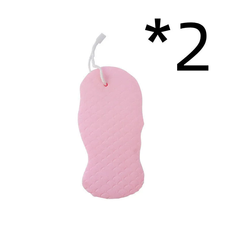 3D fish scale pattern bath sponge ball in assorted colours on a bathroom background.