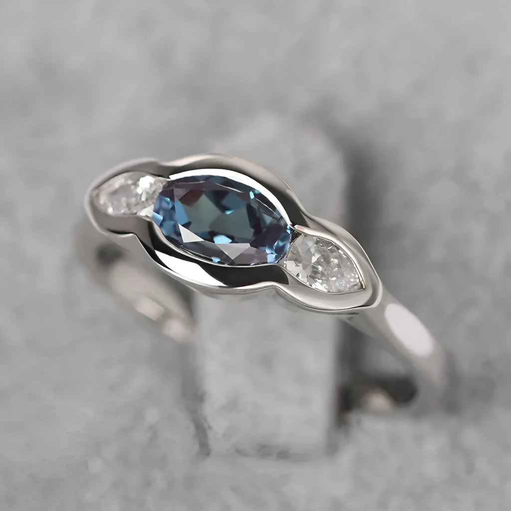 Women's geometric ellipse copper ring with inlaid zircon detail in white gold colour.