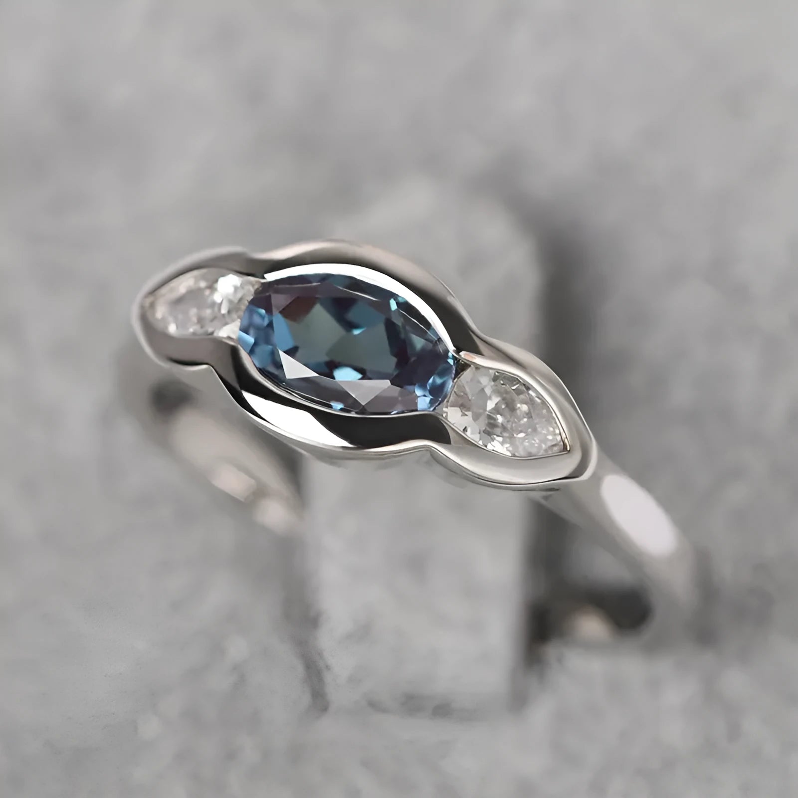 Women's geometric ellipse copper ring with inlaid zircon detail in white gold colour.