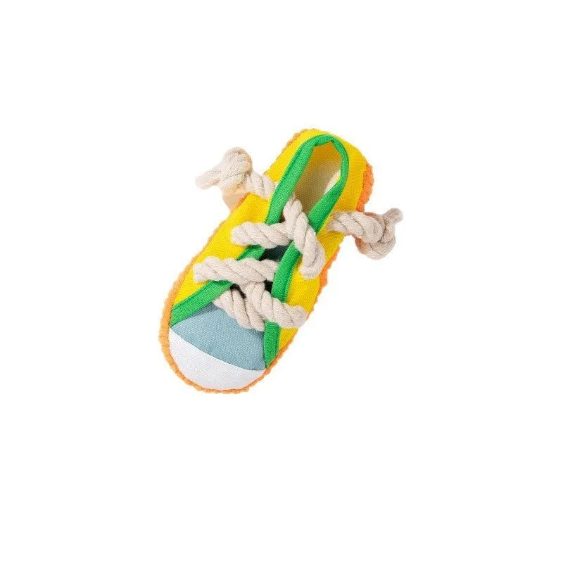 Slipper-shaped plastic dog chew toy with squeaker in yellow, black, or blue colour options