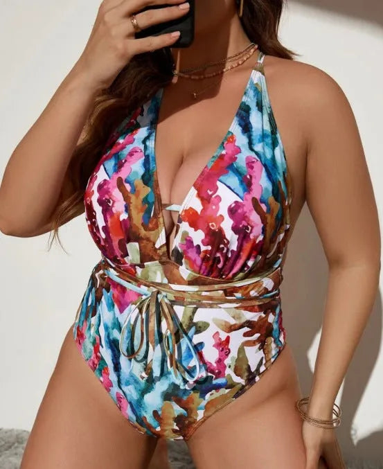 Blue women's halter neck one-piece swimsuit on a mannequin showing brief cut design