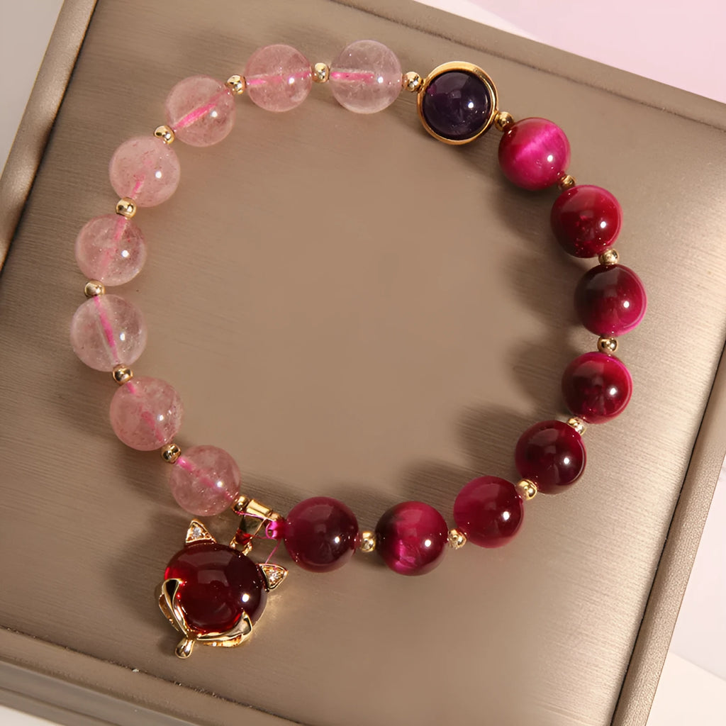Strawberry crystal bracelet on wrist showing elastic rope construction and natural stone colour