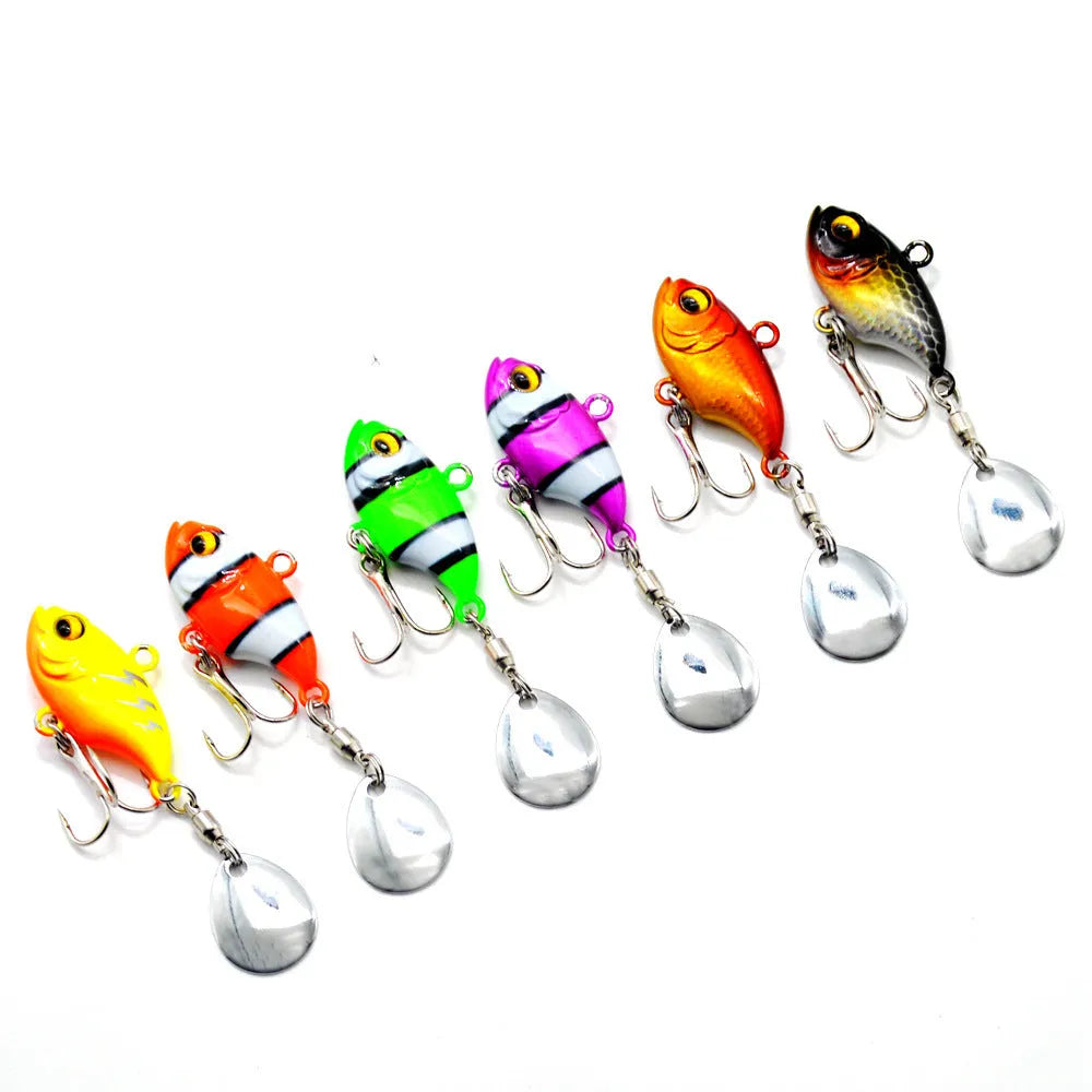 Metal plate fishing lure with rotating sequins shown in multiple colour options including zebra stripes and solid gold.