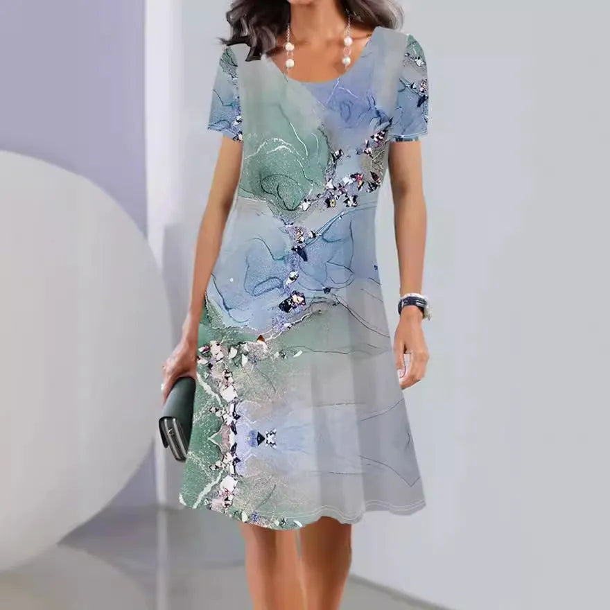 Printed mid-length summer dress with plants and flowers pattern, round neck and short sleeves