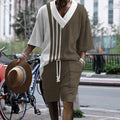 Man wearing a printed drop-shoulder knitted short-sleeve top with matching shorts, a casual loungewear set.