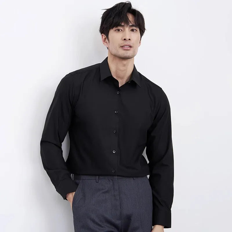 Man wearing a wine red slim fit long sleeve business casual shirt.