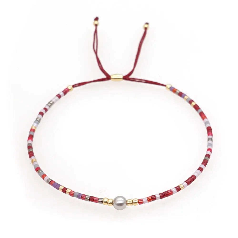 Handmade colourful Bohemian bracelet with geometric glass and coloured glaze beads in various colour options