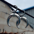 Silver geometric hoop earrings with moon decoration and clip-on fastenings