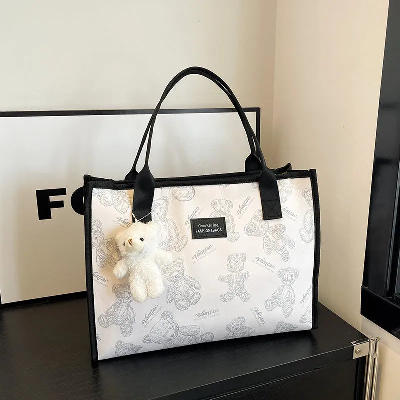 Women's black and white printed canvas tote bag with rhombus pattern and shoulder strap