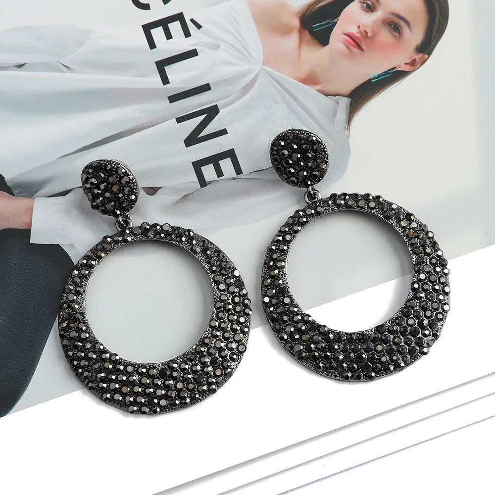 Colourful alloy drop earrings with large round pendants featuring diamond-effect detailing and cartoon-inspired styling