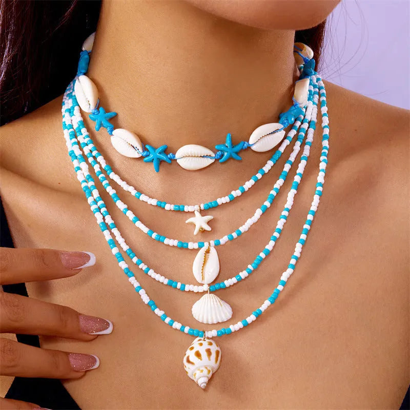 Blue shell and starfish pendant necklace set with five pieces on 21-50cm chains