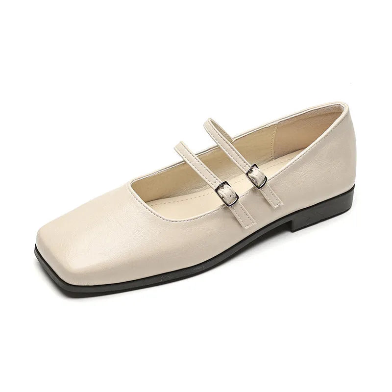 Women's silver genuine sheepskin leather ballet pumps with a cross buckle strap and flat low heel.