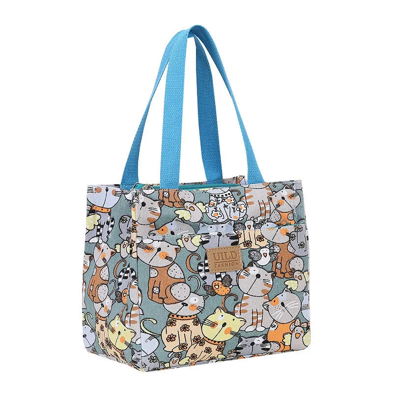 Women's printed canvas handbag with aluminium frame in multiple floral and animal print designs
