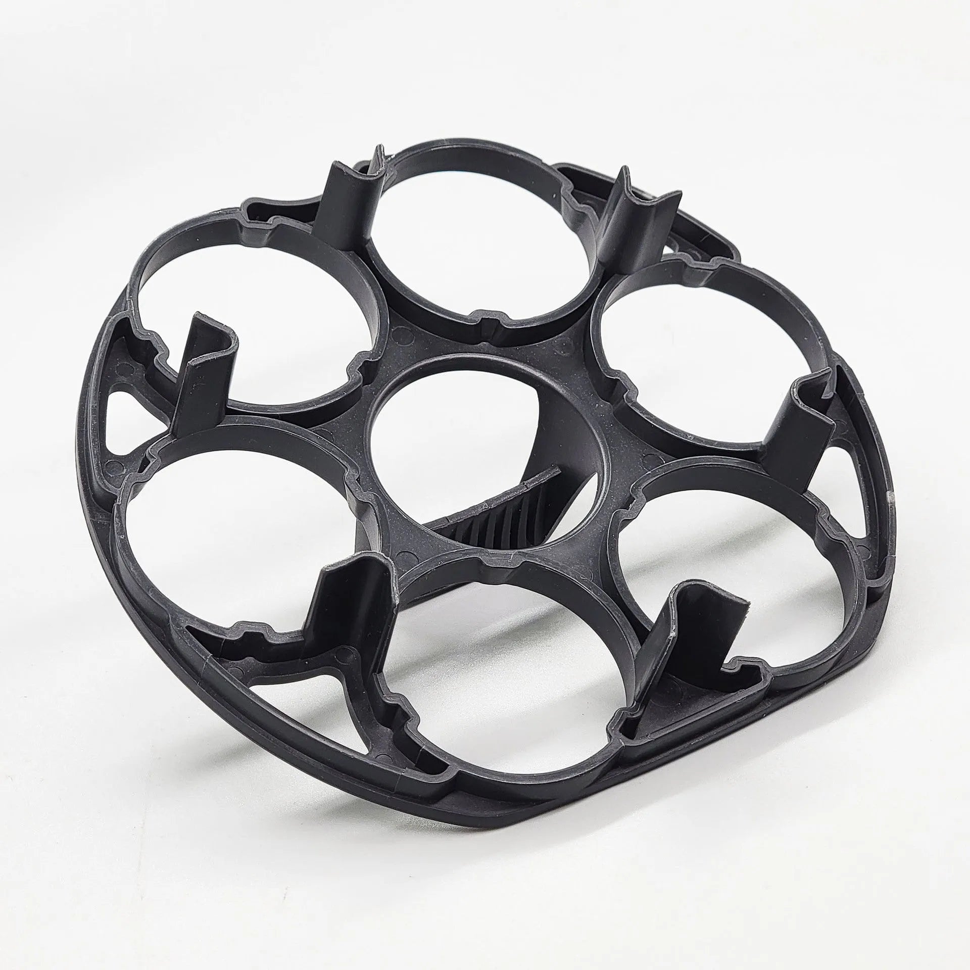 Black plastic egg holder measuring 13.8cm with retainer function for cooking machine storage