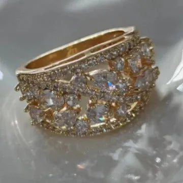 Women's round hollow copper ring with a central stone, shown in gold and platinum finishes.